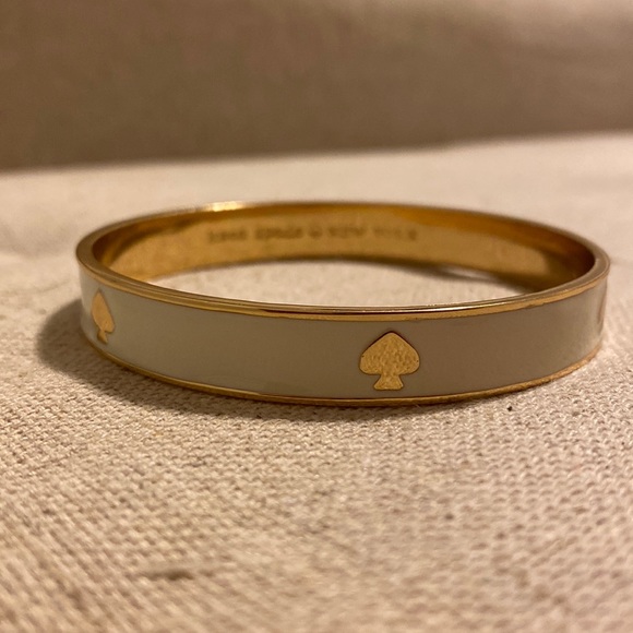 kate spade Jewelry - Kate Spade White Bangle With Gold Spade